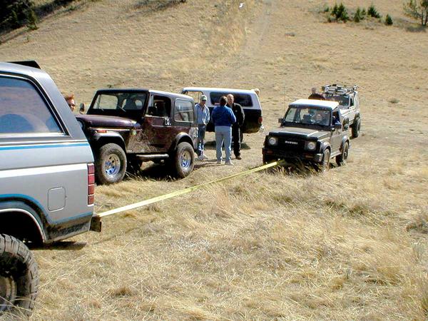 PA180019 - Brian's Zuk preparing for the 1st steep ascent.
It was semi-handicapped with 2wd.
No problem, we'll just pull ya up