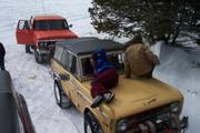 Shannon and Shauna keep warm on the hood of the Bronco