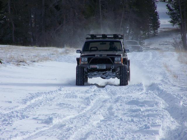 Mike H hauling butt across a hard packed drift.