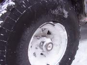 The rock took a bite out of Don's rim.  After trying to beat the bent rim back into shape, the spare was called into service.