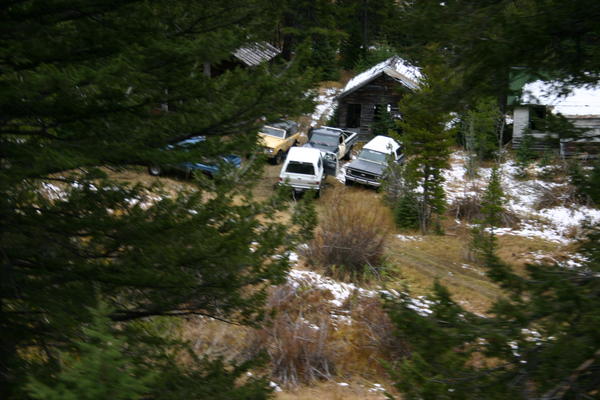 Higher view of the mine with rigs around it.