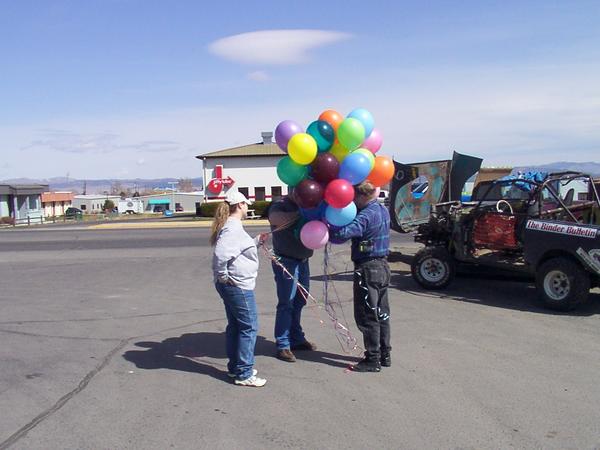 How many people does it take to untangle balloons?  Don, Amanda, and Tyler struggle..