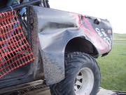 100 0754
The shiny new paint and brand new quarter panel after starting line of  the Baja Main