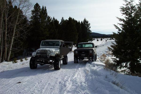 Tom's Scout next to Loretta's Jeep