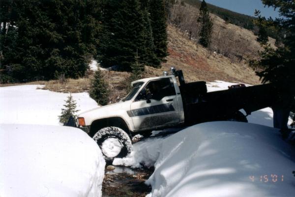 Justin J. - 5" lift, 35" tires, rear locker, front limited slip, warn winch, custom flat bed.