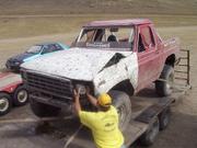 Blair removes an in-tact headlight before it breaks on the tow home.