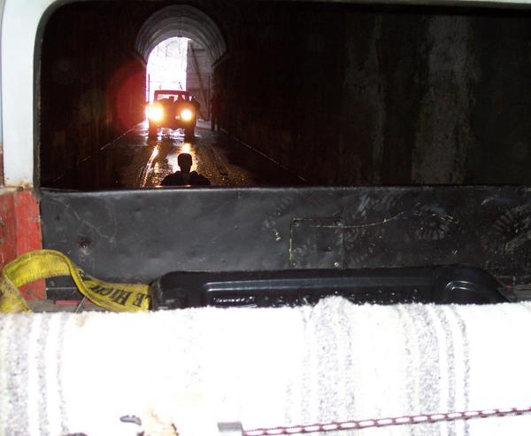 Chris Lamping hitching a ride through the tunnel on an Action Packer lid