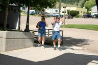 Frontier members Bryan and Joan Lewis walking up to help - Brian in mid "fix my hair after riding in the Jeep"