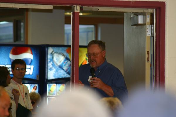 Jim Anderson giving away prizes