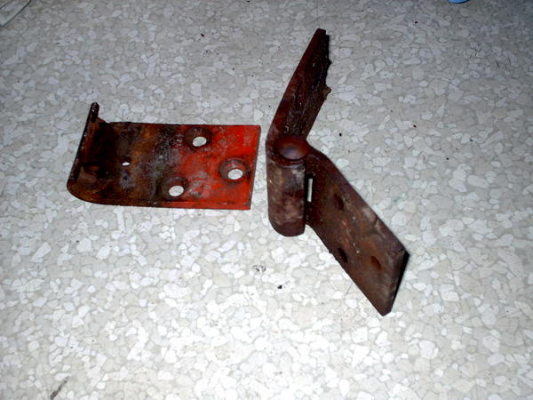 The old hinges, I had to drill off the screw heads, then replace the mount plates in the door frame.