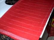 Cardinal red tweed cut to a little larger than needed, then glued to 1/4" pleating foam, marked for stitching.
Yep, I am d
