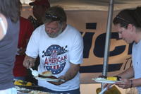 Cascade County member Leonard Nelson dishing up dinner