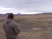 Dennis then completes the right hand turn and angles away from the spectators on a rolling downhill stretch, where he'll then ma