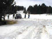 P3150021 - The trail boss is stuck, and there's lots of folks hangin' around with shovels.