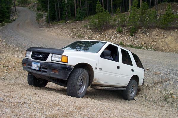 Ray tries to climb the gravel pile and gets hung up on his receiver hitch.  Oops.